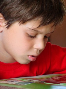 young boy reading